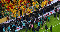 Senegal fans react in the stand after Morocco were awarded a penalty following a VAR review
