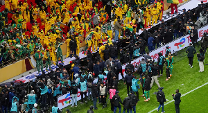 Senegal fans react in the stand after Morocco were awarded a penalty following a VAR review