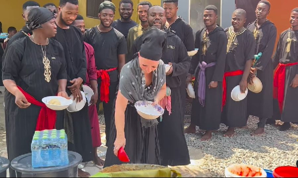Caucasian woman dishes out banku at Ajaguraja's church