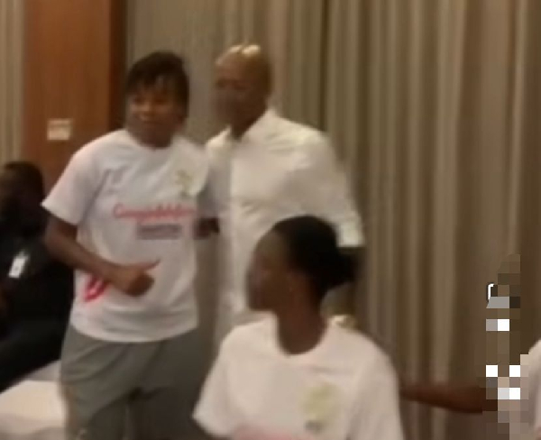 Dede Ayew (M) surrounded by some Black Queens players