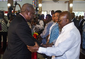 President John Mahama in a handshake with Nana Akufo-Addo