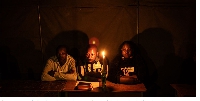 Election agents wait for the polls to close at a polling station during Zimbabwe's election