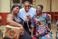 MzGee [C] with some mothers during the donation