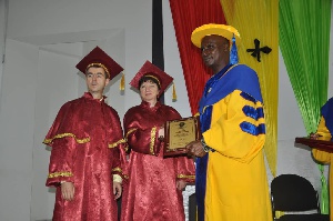 Alhaji Labaran Issah receives his certificate from Professor Eugene Cronoff