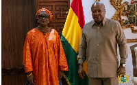 Madam Fall (L) President John Dramani Mahama (R)