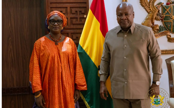 Madam Fall (L) President John Dramani Mahama (R)