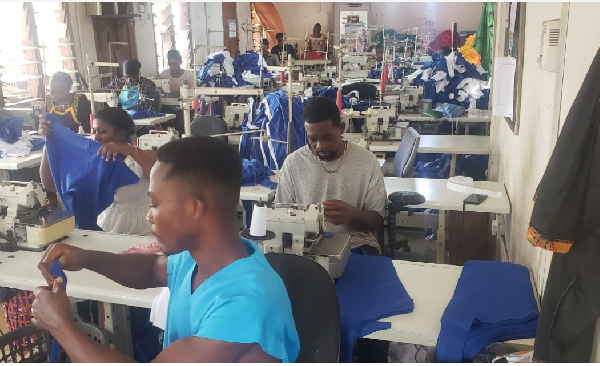 Workers of a garment company are seen working