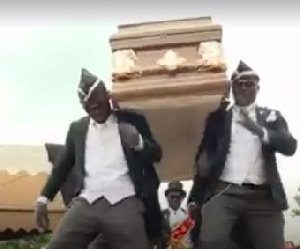 Dancing pall bearers displaying at a typical Ghanaian funeral