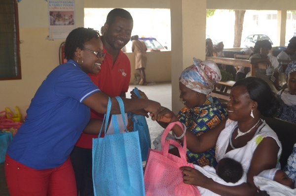 Yaw Ofori Owusu & Ms. Eleanora Agyei handing (Airtel Employees) handing over NAP to some mothers