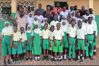 Some of the pupils in a group photograph with the Zongo Minister and others