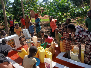 Many of the excited residents lined up with Jerry cans to get clean water