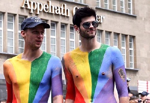 Two men at a gay pride parade