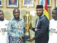 Hon Nii Agyei Sowah and Yaw Ampofo Ankrah display the trophy