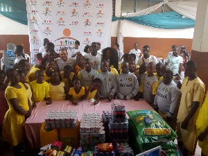 Jonathan Mensah in a group picture with students of Dzorwulu Special School