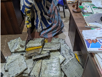 49-year-old trader, Issaka Mohammed with some of the items