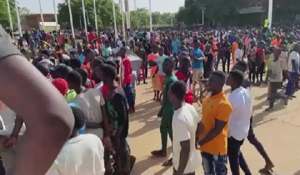 Volunteers outside a stadium in Niamey
