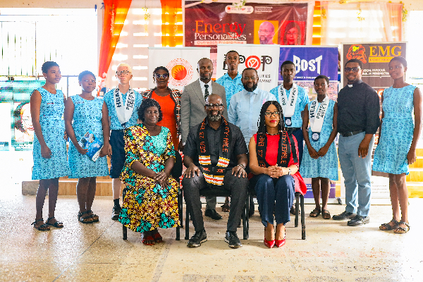 Some Wesley Grammar students in a photo with Dr. Edwin Provencal and others