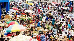 Some traders in a market (file photo)