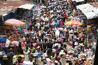 Several traders at the Kumasi market in the Ashanti region
