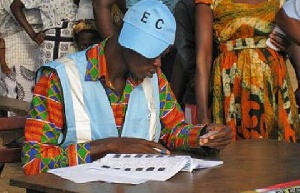 An old photo of an EC official scanning through the ballot paper