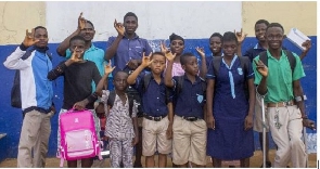 Beneficiaries acknowledging cheers and showing appreciation in a sign language after presentation