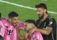 Luis Suarez (left) biting the finger of Jordi Alba (middle)