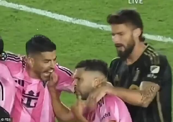 Luis Suarez (left) biting the finger of Jordi Alba (middle)