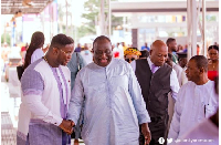 Adenta Kumi (L) seen shaking hands with Alan Kyerematen