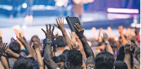 Members of the congregation during a praise and worship session in church