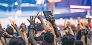 Members of the congregation during a praise and worship session in church