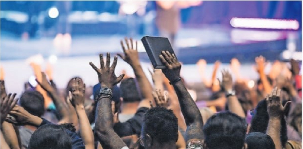 Members of the congregation during a praise and worship session in church