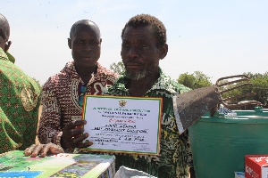 Visually impaired Aduni Achana, cultivates rice at Bonia in the Kasena-Nankana Municipal Assembly