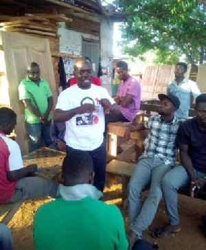 Emmanuel Osei, National Coordinator Volunteers for Nduom interacting with others