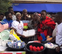 Fella Makafui hands over the donated items to the people