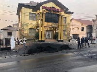 Burnt tyres in front of the Menzgold building in Kumasi