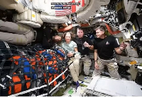 The four astronauts in their spacecraft