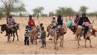 Sudanese refugees cross into Chad near Koufroun, Echbara, on May 1, 2023.