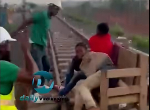 Watch as officials flog young men sleeping on railway tracks