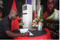Kwabena Kwabena signs the book of condolence for KABA