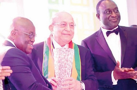 Pres. Akufo Addo presenting an award to Saied Fahkri and Alan Kyeremanteng (r) with them