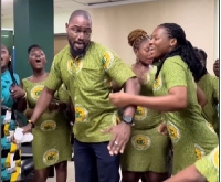 Some of the members of the choir dancing and singing