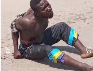 The thief is seen beaten mercilessly