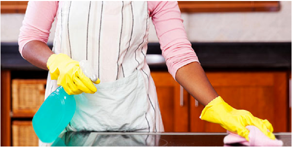 A photo of a domestic worker cleaning