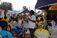 Nurse Esther from IHCC teaching the  people how to use condom