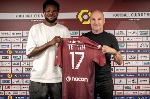 Ghanaian forward, Benjamin Tetteh with a club official