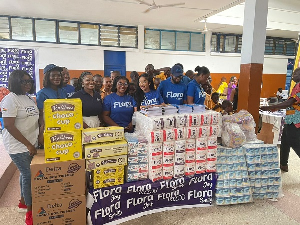 Serwaa, Amihere, Piesie Esther in a group photo with the student and staff of the company