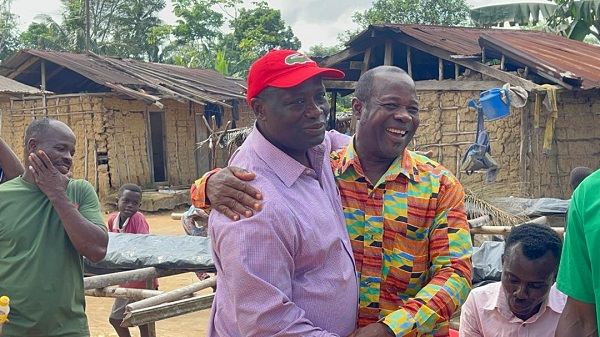 Armah-Kofi Buah hugging one of his constituents