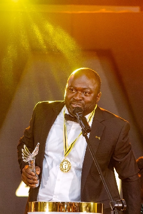 An official of Jospong Group after taking an award