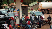 Motorists at a petrol station in Kampala, Uganda