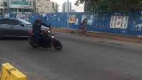 Former president Mahama seen on a motorbike, after visiting his brother Ibrahim Mahama